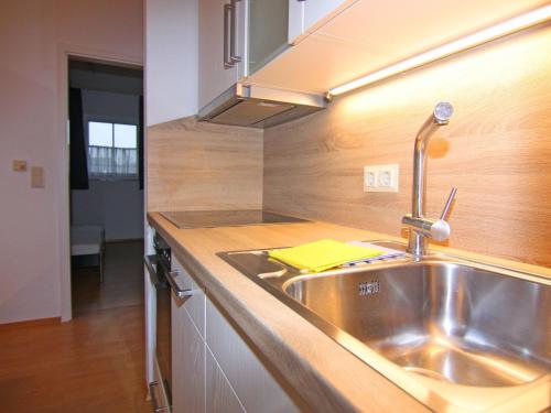Η κουζίνα ή μικρή κουζίνα στο Ferienwohnung in Lemkenhafen for 2 Personen