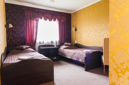Postelja oz. postelje v sobi nastanitve Hotel Andersen