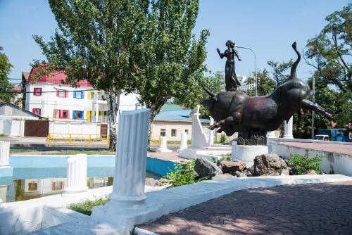a statue of a woman on a horse in a park at 12 Months Mini Hotel in Odesa