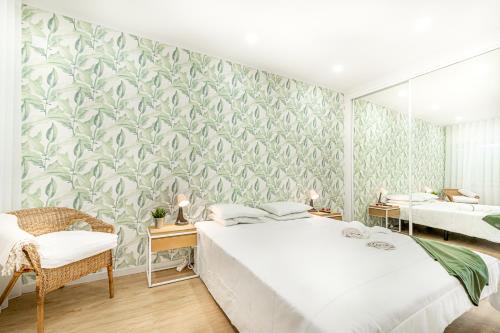 a bedroom with a bed and a wall mural at Two bedroom apartment close to train station by Lisbon with Sintra in Queluz