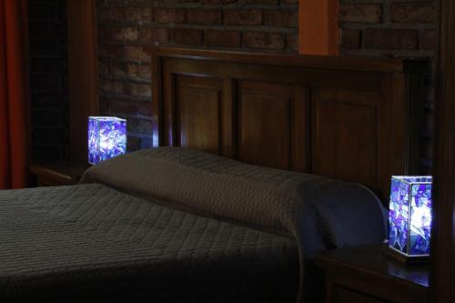 a bedroom with a bed with two lights on it at Casa Diez-59 Guanajuato Capital in Guanajuato