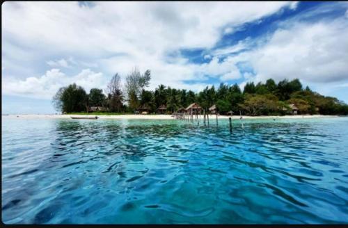 an island in the middle of a large body of water at Yefkabu Homestay Raja Ampat in Waisai