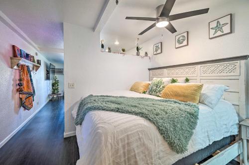 a bedroom with a bed and a ceiling fan at Parker Studio with Patio and Direct River Access! in Parker