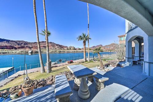 a house with a view of the water and palm trees at Parker Studio with Patio and Direct River Access! in Parker