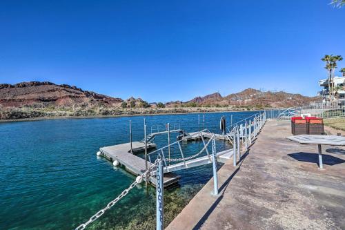 a dock in the middle of a body of water at Parker Studio with Patio and Direct River Access! in Parker