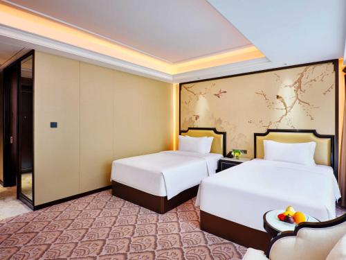 Postel nebo postele na pokoji v ubytování The Yun Hotel Foshan Nanhai-Near Pazhou Complex