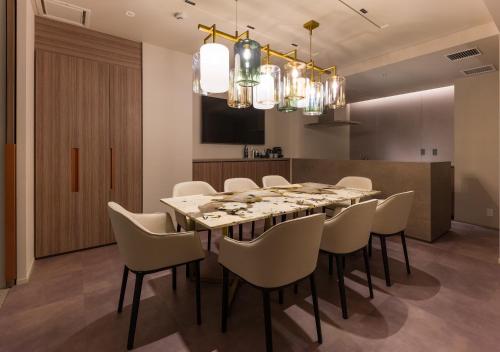 a dining room with a long table and chairs at THE skM TOKYO HOTEL & DINING in Tokyo
