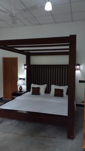 מיטה או מיטות בחדר ב-Nageran Homestay