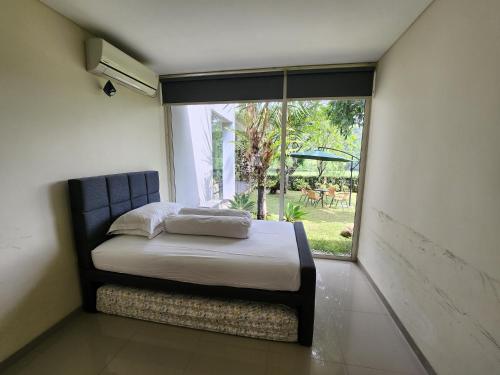 Postel nebo postele na pokoji v ubytování Jagad House