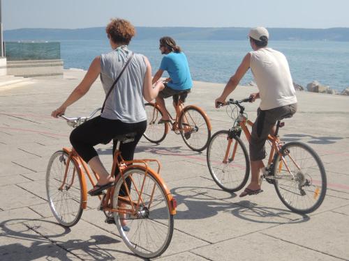 three people riding bikes on the beach at Adrenaline Check Kaki Event Place in Portorož