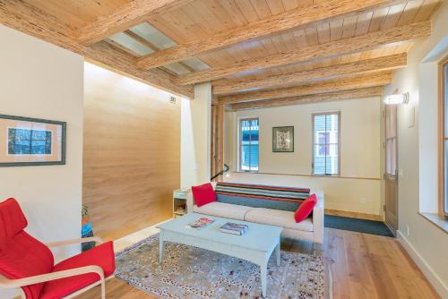 a living room with a couch and a table at Sun-Filled Sunnyside Home On North Fir St - Eco-Friendly Home - Peace & Privacy home in Telluride