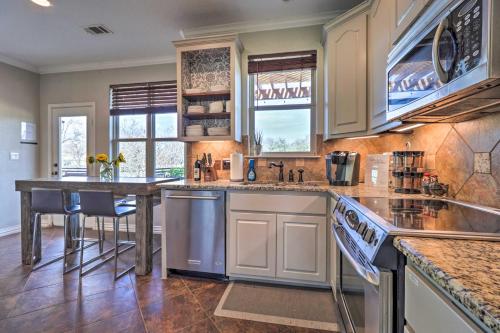 a kitchen with white cabinets and a counter top at Lake LBJ Waterfront Vacation Rental! in Granite Shoals
