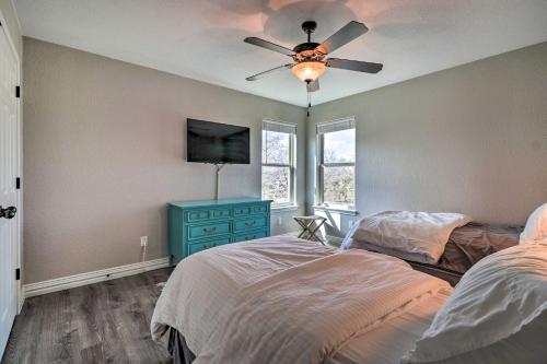 a bedroom with a bed and a ceiling fan at Lake LBJ Waterfront Vacation Rental! in Granite Shoals