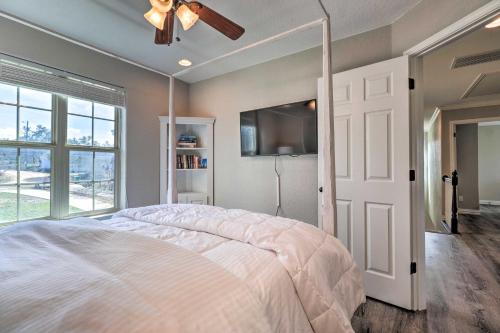 a bedroom with a large bed and a ceiling fan at Lake LBJ Waterfront Vacation Rental! in Granite Shoals