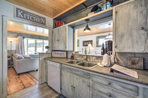 a kitchen with a sink and a counter top at Family Home - Walk to Town and Balsam Lake! in Balsam Lake