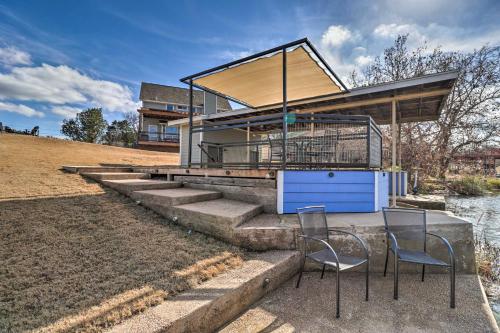 a house with two chairs and a table and stairs at Lake LBJ Waterfront Vacation Rental! in Granite Shoals