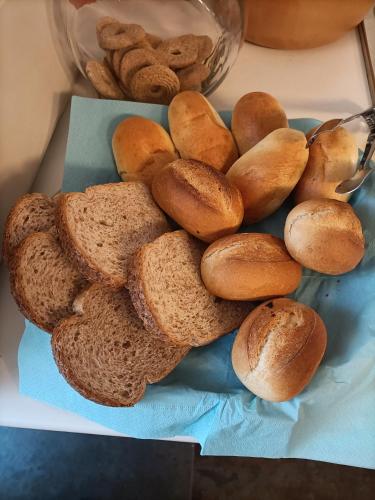 a pile of bread and bagels on a table at Atmosfera Affittacamere in Ravenna