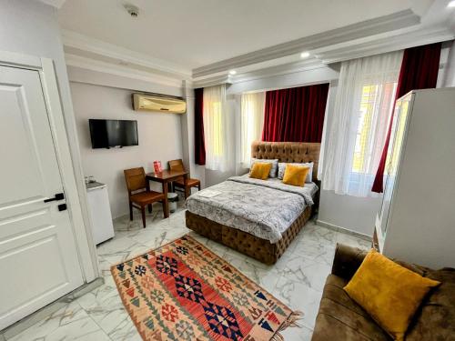 a hotel room with a bed and a couch at Pembe Hotel in Istanbul