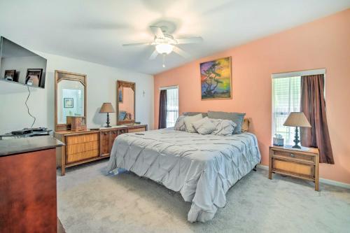 a bedroom with a bed and a ceiling fan at Wildwood Vacation Rental Near Golf and Dining! in Wildwood