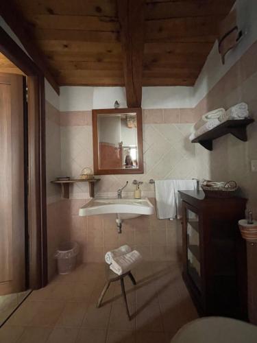 a bathroom with a sink and a mirror at La Magara in Civita