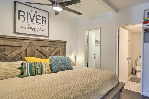 a bedroom with a large bed with a wooden headboard at Parker Studio Nestled on the Colorado River! in Parker