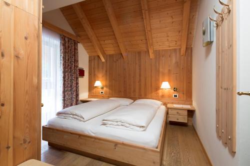 Un pat sau paturi într-o cameră la Residence Mugun