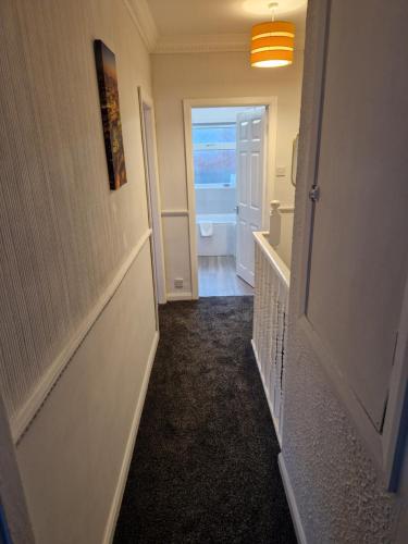 a hallway with a door leading to a bathroom at Grange Villa Amethyst 3 Bed House near Chester le Street, sleeps 6 Guests in Chester-le-Street