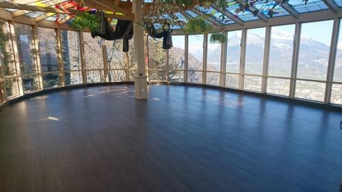 a dance floor in a building with a view at Komplettes Hotel mit 10 Zimmern in Bad Ragaz