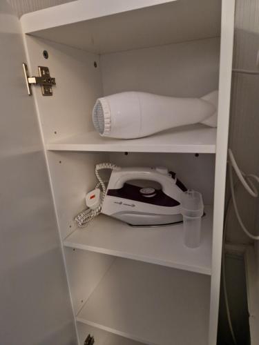 a telephone and a roll of paper in a closet at Grange Villa Amethyst 3 Bed House near Chester le Street, sleeps 6 Guests in Chester-le-Street