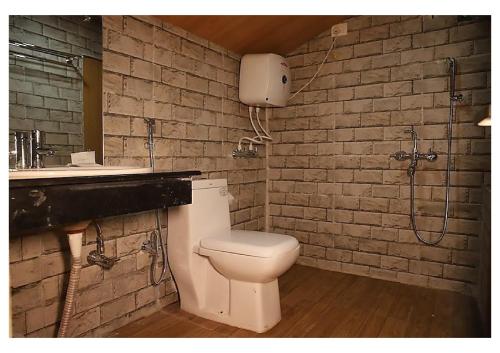 a bathroom with a toilet and a sink at Stay villa Retreat in Pelling