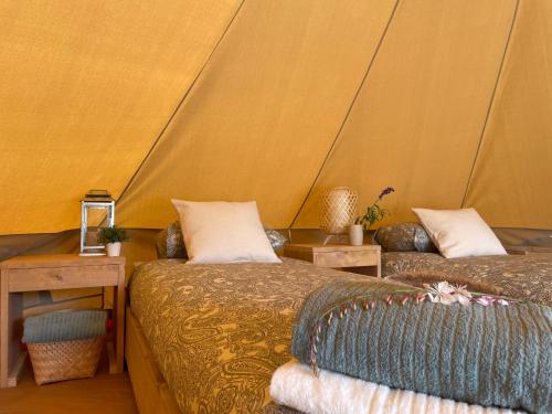 a room with two beds in a tent at Quinta da Boa Sorte in Estói