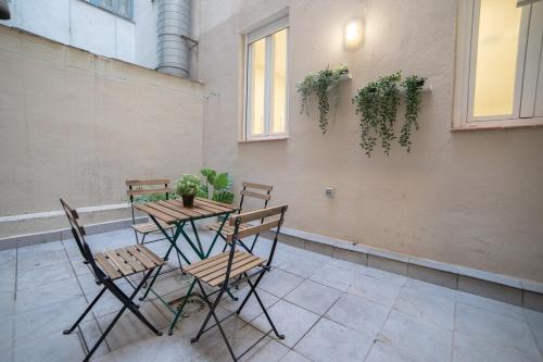 a table and chairs sitting on a patio at MyHouseSpain - Acogedor piso con patio en Chamberi in Madrid