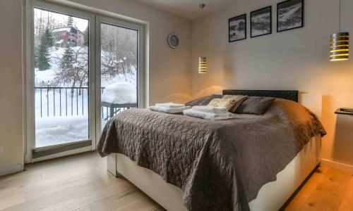 Ένα ή περισσότερα κρεβάτια σε δωμάτιο στο Apartament Led Sonoma