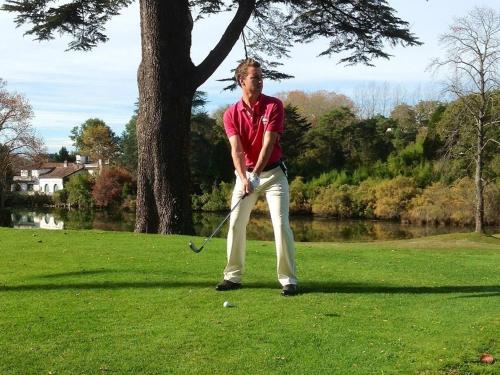 a man is playing golf on a field at MAROSENIA TTIKI - Cabanes et Spa in Ascain