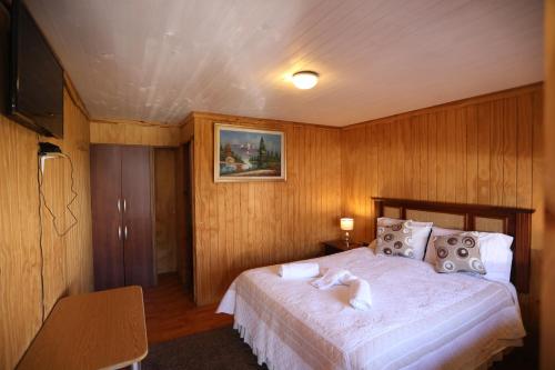 Giường trong phòng chung tại Hospedaje Icalma