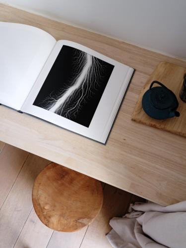 a table with a book on top of a table at Verne Dreams in Ghent
