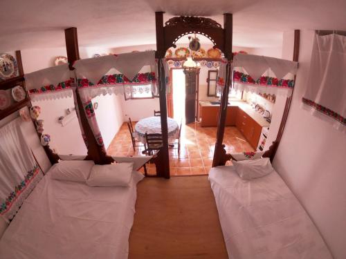 a room with two beds and a room with a mirror at LoView Avlona 