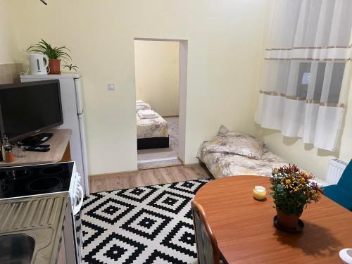 a small living room with a couch and a table at Wohnung 18 in Lutherstadt Eisleben