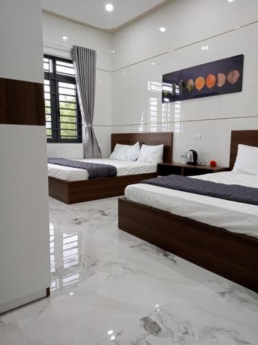 Postel nebo postele na pokoji v ubytování Motel Hòa Hiệp