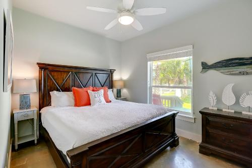 a bedroom with a large bed and a window at Beachy Keen in Port Aransas