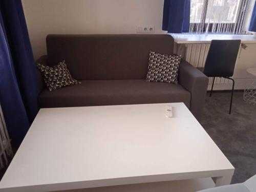 a living room with a couch and a table at Koleje Zamecek in Lednice
