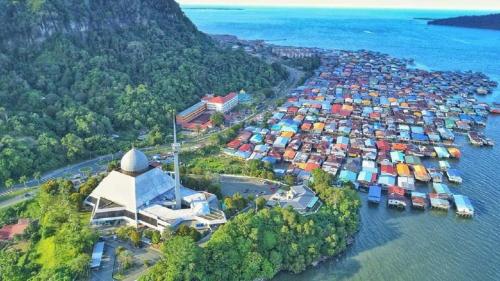 an aerial view of a harbor with boats in the water at Lovely & Cozy Apt In Nature City in Sandakan