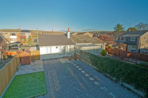 an aerial view of a house with a yard at Home Sweet Bungalow in Queensbury