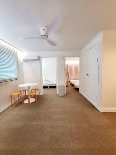 a room with a table and chairs and a bedroom at Sinchon station 4 min three-room hongdae in Seoul