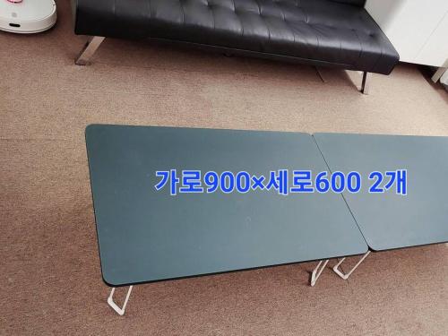 a blue table in front of a black couch at Sinchon station 4 min three-room hongdae in Seoul