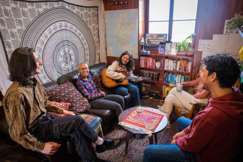 a group of people sitting in a living room at Royal Mile Backpackers in Edinburgh