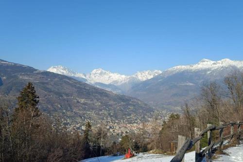 a view of a mountain range with snow covered mountains at Tana della volpe 1 in Gressan