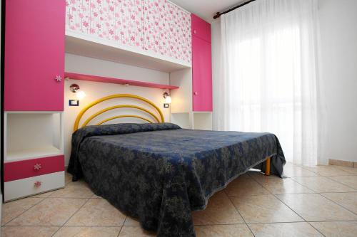Postel nebo postele na pokoji v ubytování Residence La Pigna