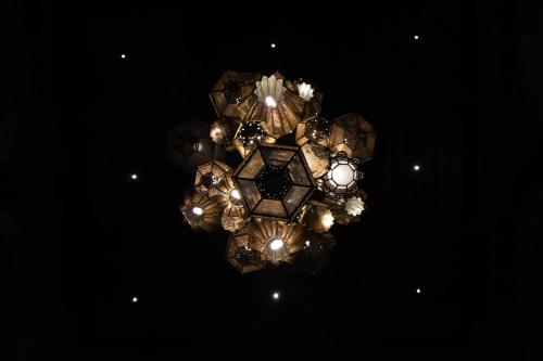 a chandelier hanging from the ceiling in a room at Casa 1810 Hotel Boutique in San Miguel de Allende