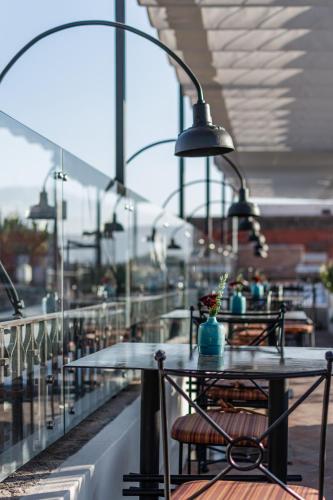 a table and chairs on a balcony with lights at Casa 1810 Hotel Boutique in San Miguel de Allende